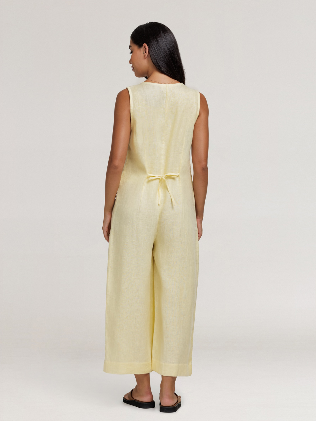 Model wears Florentina Linen Jumpsuit in Lemon