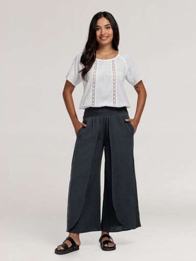 Model wears Asana Cotton Wrap Pants in Charcoal