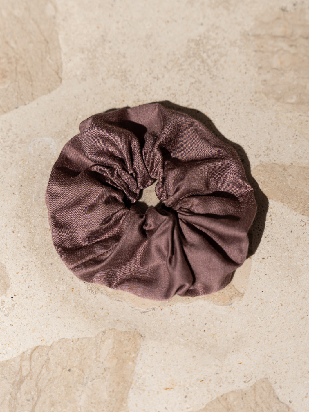 Image features Jumbo Lenzing Ecovero Scrunchie in Plum