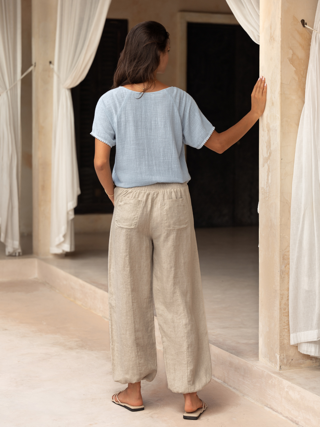 Model wears Malibu Linen Pants in Flax