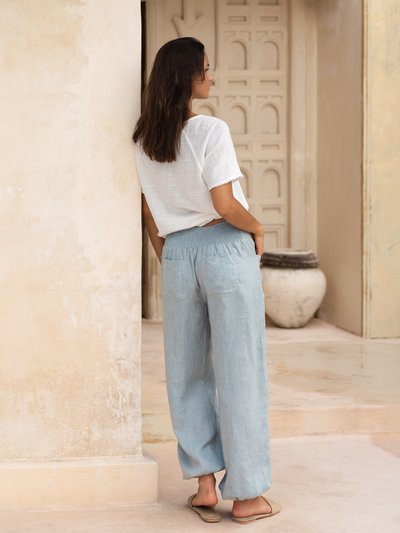 Model wears Malibu Linen Pants in Slate Blue