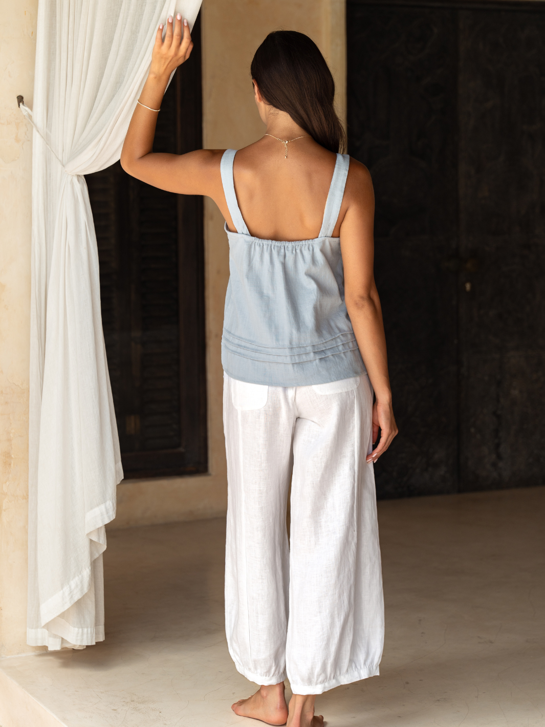 Model wears Sadhu French Linen Pants Regular in White