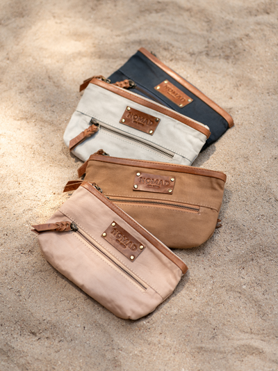 Image features Avalon Canvas Clutch in Tea Rose, Desert Sand, Slate Blue & Charcoal