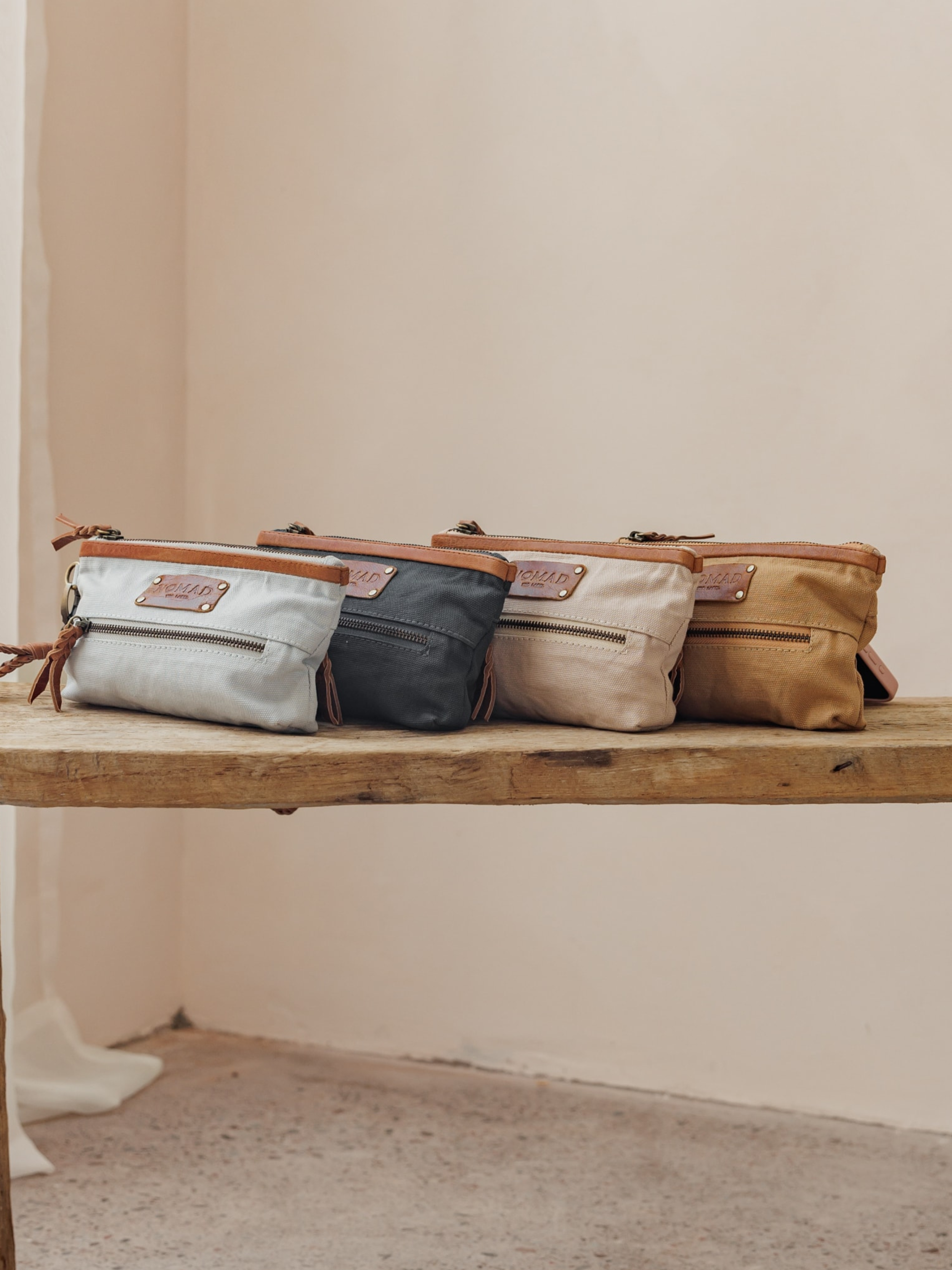 Image features Avalon Canvas Clutch in Tea Rose, Desert Sand, Slate Blue & Charcoal