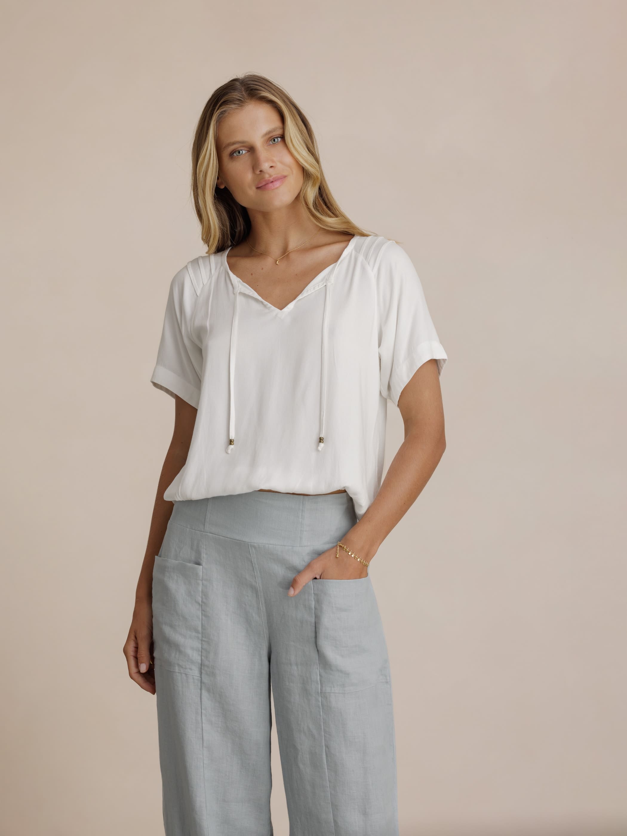 Model wears Malibu Linen Pants in Slate Blue