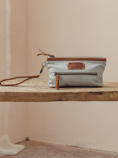 Image features Avalon Canvas Clutch in Slate Blue