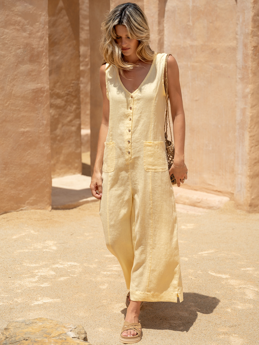 Model wears Florentina Linen Jumpsuit in Lemon