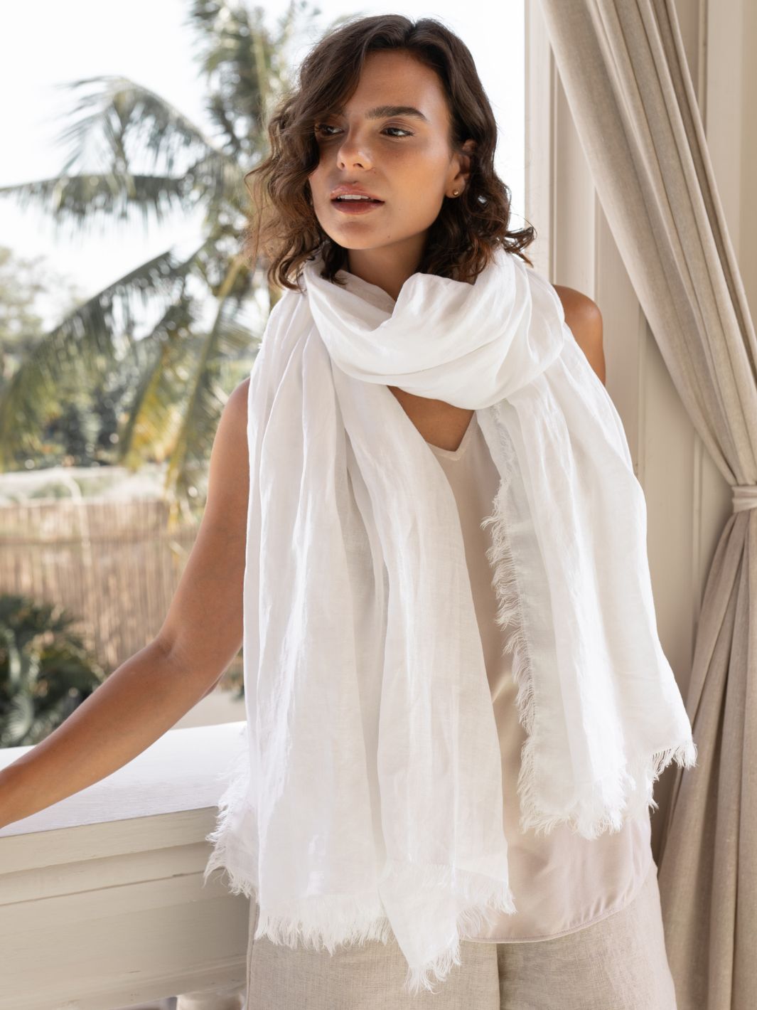 Model is wearing Omari Linen Scarf in White