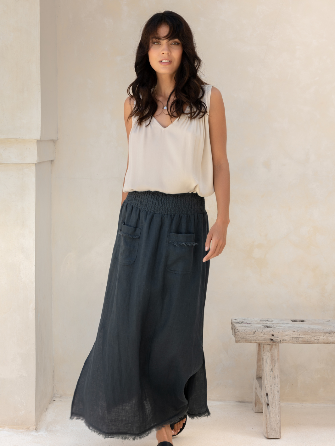 Model wears Aurora French Linen Skirt in Charcoal