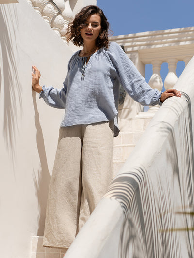 Model wears Capri Cotton Blouse in Slate Blue