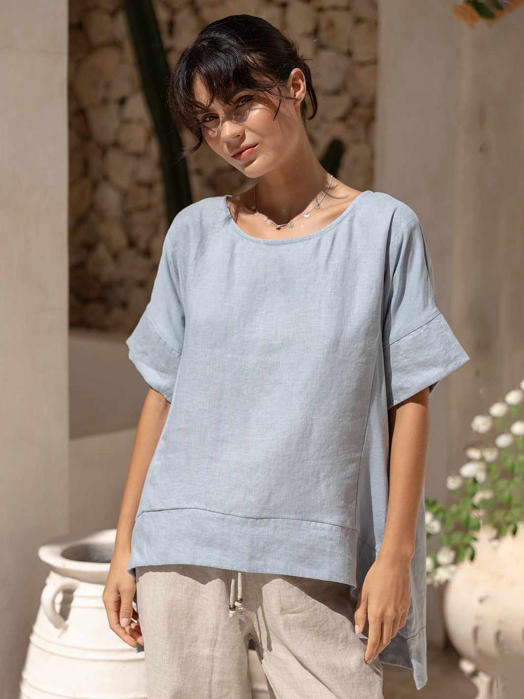 Model wears Costa French Linen and Cotton Top in Slate Blue.