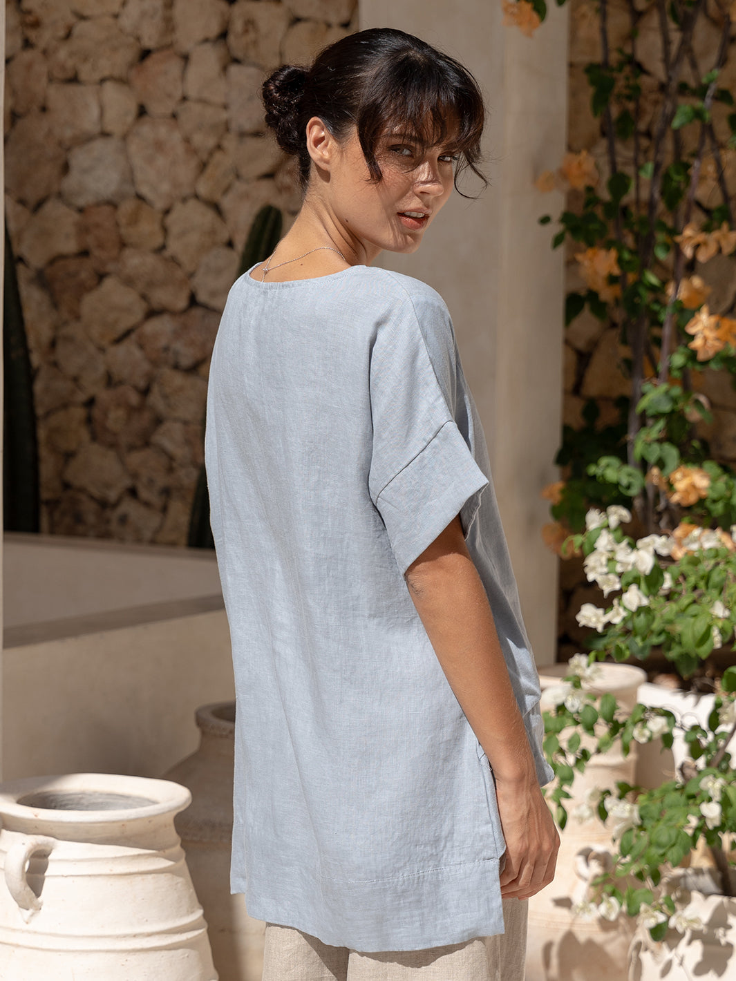 Model wears Costa French Linen and Cotton Top in Slate Blue.