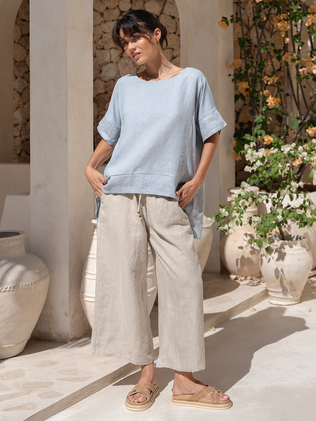 Model wears Costa French Linen and Cotton Top in Slate Blue.