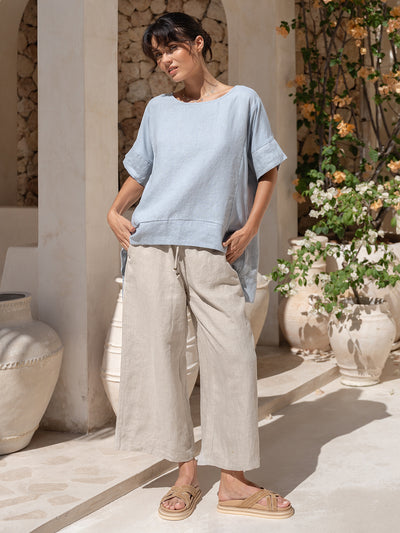 Model wears Costa French Linen and Cotton Top in Slate Blue.