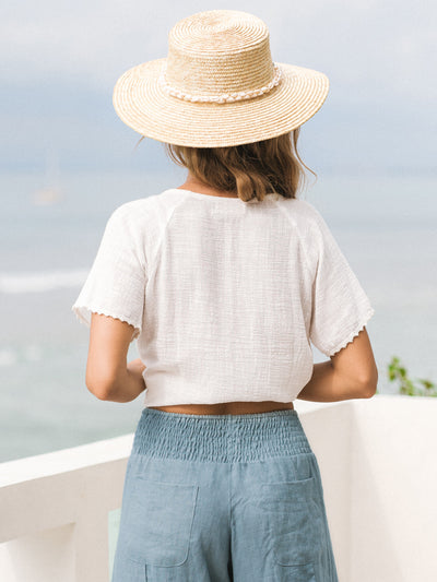 Model wears Daisy Organic Cotton Blouse in Ivory