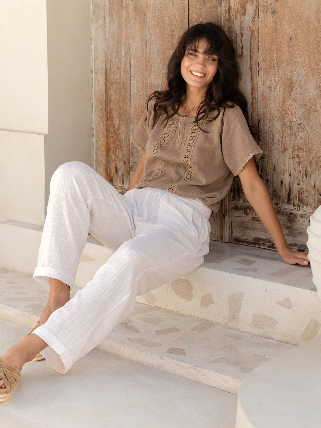 Model wears Daisy Organic Cotton Blouse in Cinnamon.