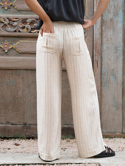 Model is wearing Del Mar Linen Blend Pants in Black Pinstripe