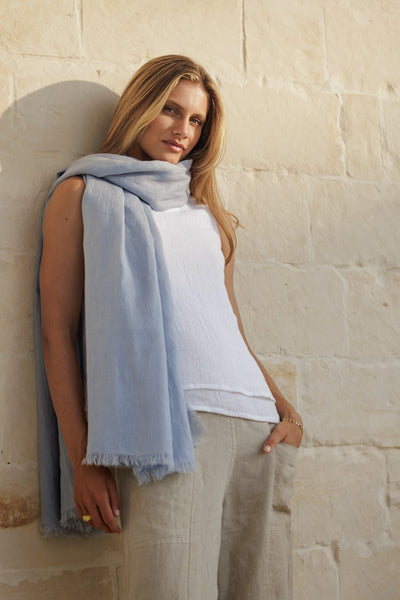 Model wears Omari Linen Scarf in Slate Blue.