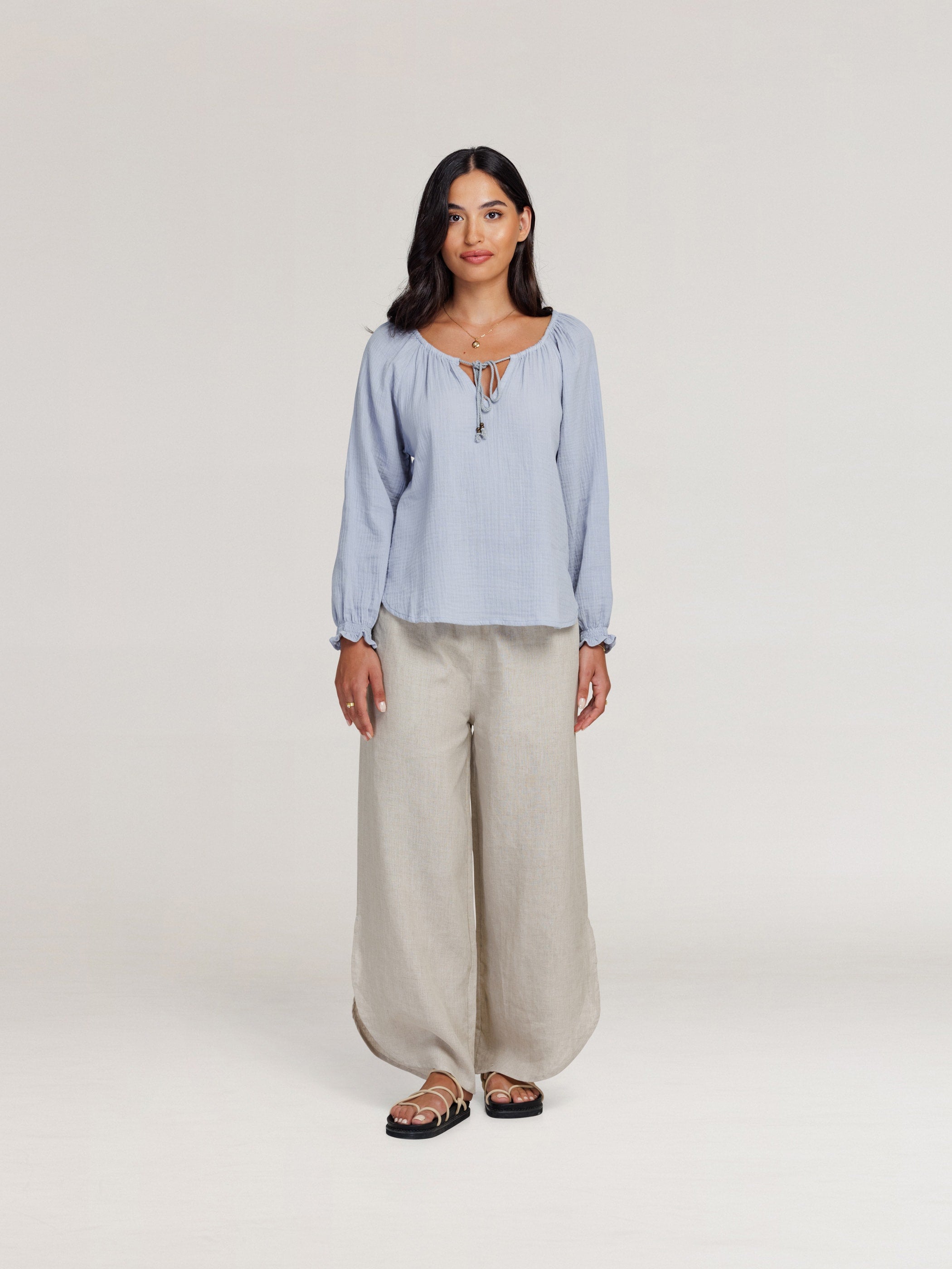 Model wears Capri Cotton Blouse in Slate Blue