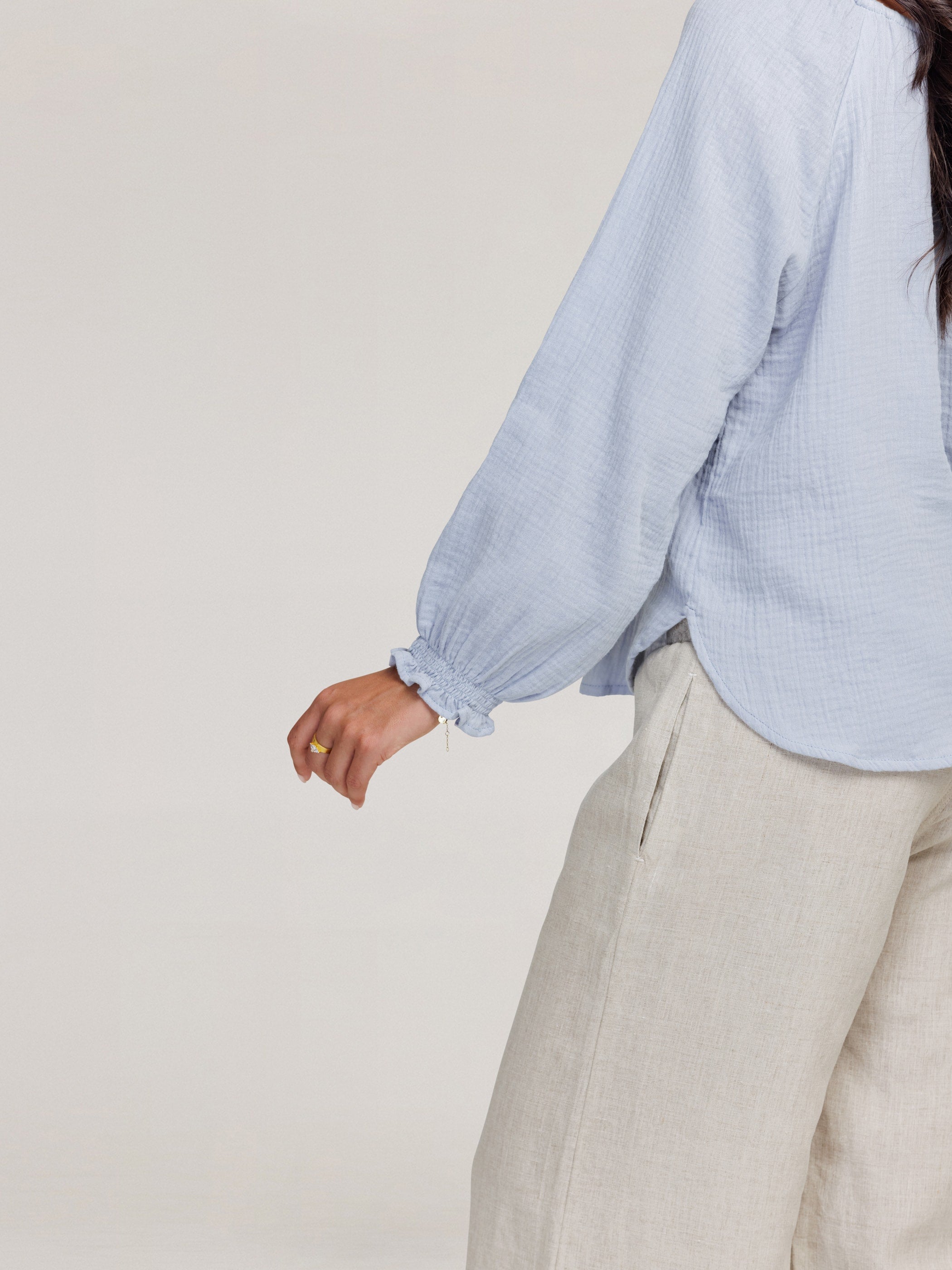 Model wears Capri Cotton Blouse in Slate Blue