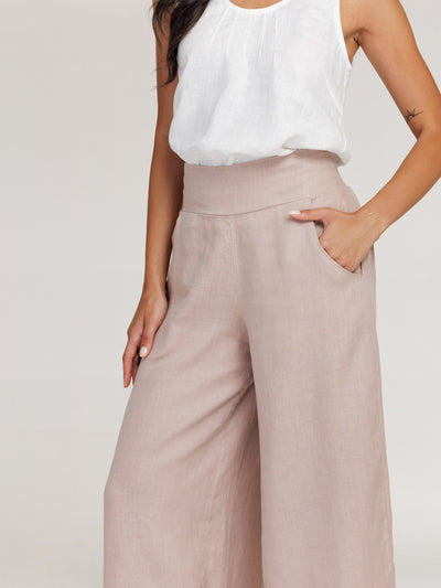 Model wears Portillo Linen Pants in Tea Rose