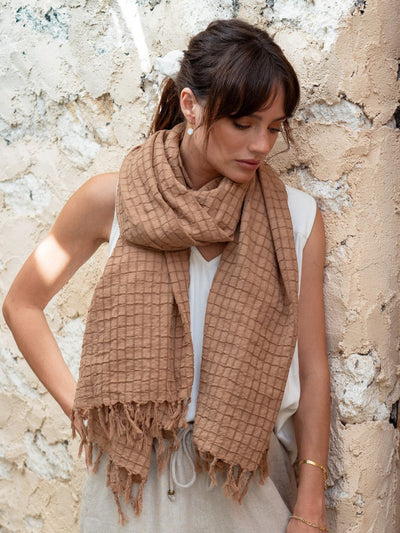 Model wears Lugano scarf in Desert Sand