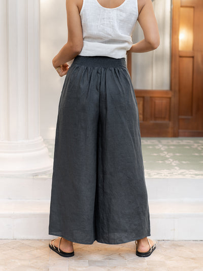 Model wears Portillo Linen Pants in Charcoal