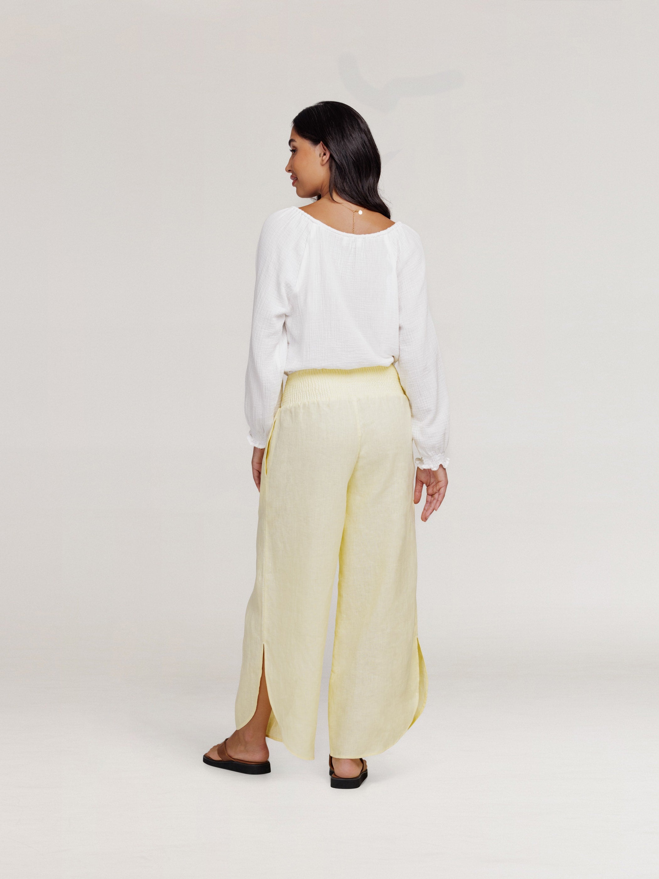 Model wears Sienna Linen Pants in Lemon