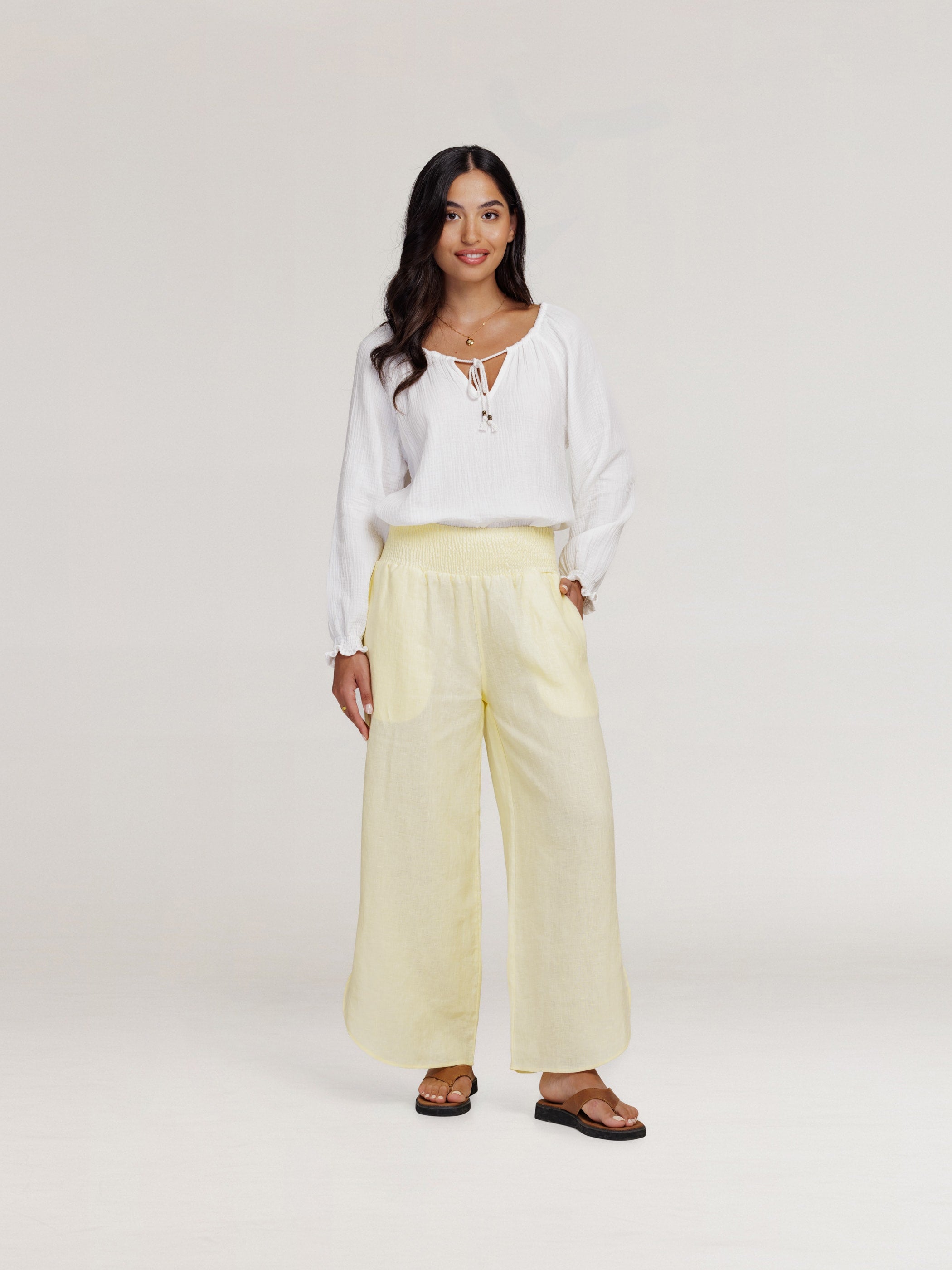 Model wears Sienna Linen Pants in Lemon